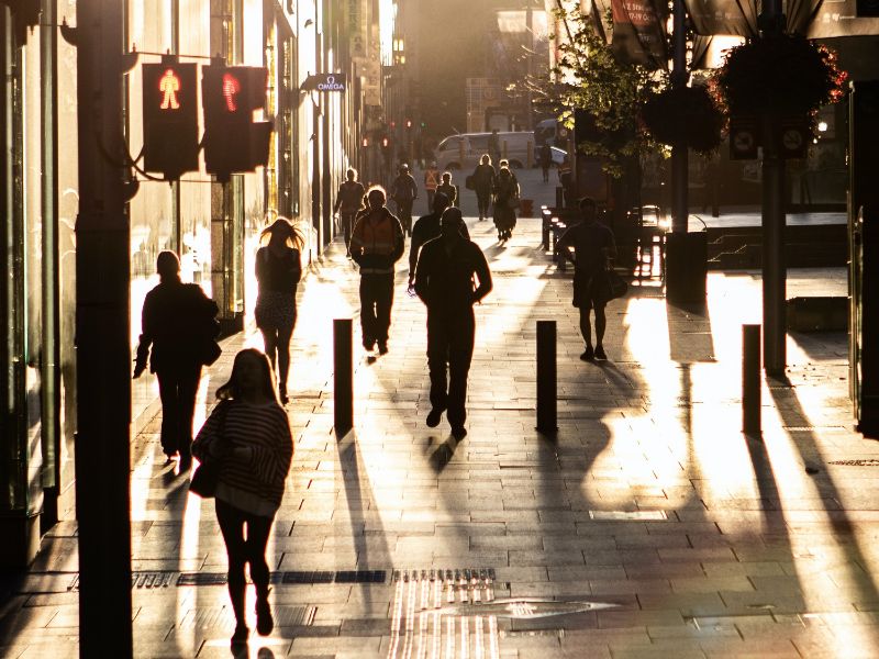 A photo of pedestrians in a city.